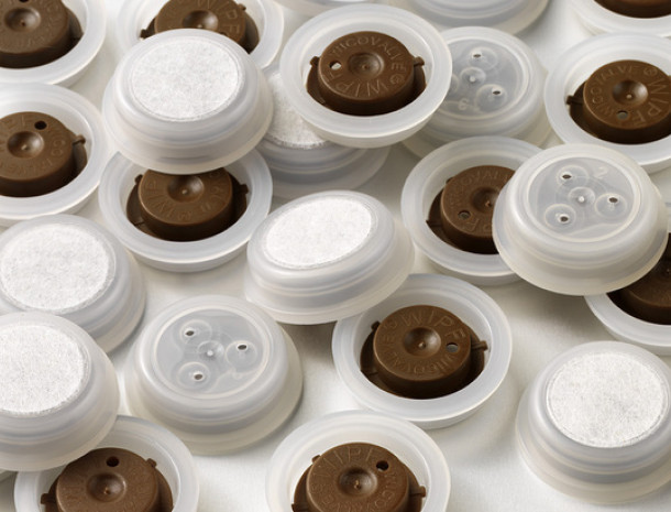 Packaging materials, such as degassing valves, zippers, flexible pouches